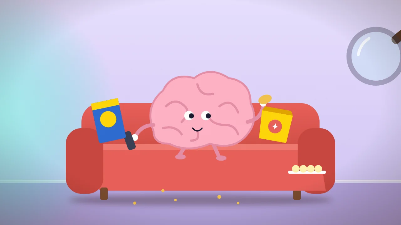 Cartoon: a brain on a sofa surrounded by crisps and cereal, watched through a magnifying glass
